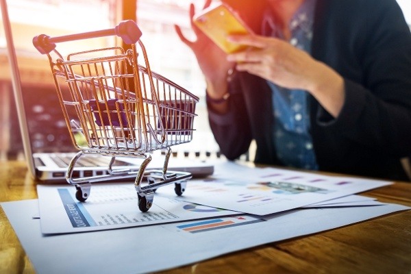 cropped-image-of-woman-inputting-card-information-and-key-on-phone-or-laptop-while-shopping-online